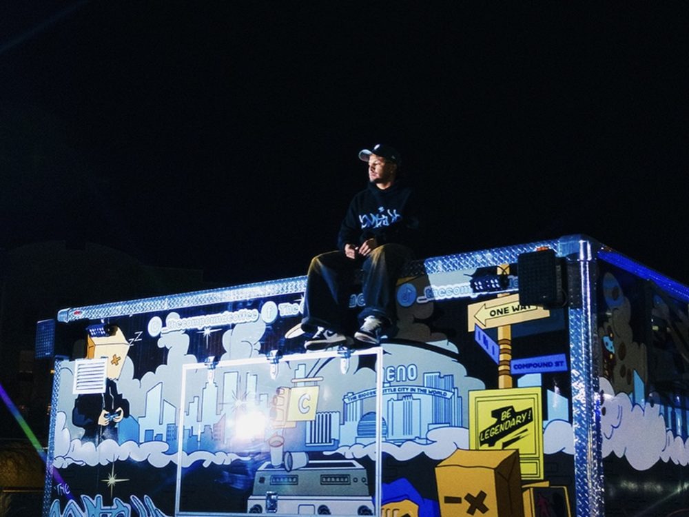 The Compound Coffee truck at night, fully wrapped in its graffiti mural