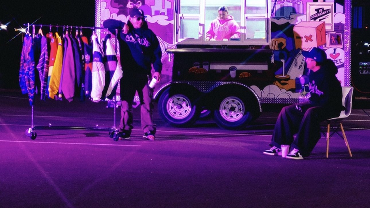 The Compound Coffee truck at a pop-up event with streetwear on the rack